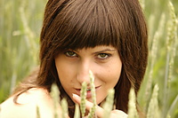 Mellow meadow wearing a delicate crocheted white cardigan, rita exudes a confident and elegant aura as she flaunts her willowy physique on the vast crop field.