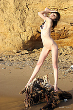 Alone lusi flaunts her petite body with pink nipples as she poses by the beach.