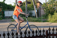 Wild ride black mo strips outdoors as she bares her sexy, slender body by her bike.