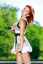 Violla a redhead violla a strip outdoors baring her curvy body.