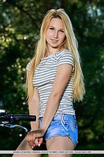 Kendell kendell rides her bike outdoors as she bares her slender body and small pussy.