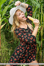 Yelena yelena playfully poses in the cornfield baring her meaty pussy.